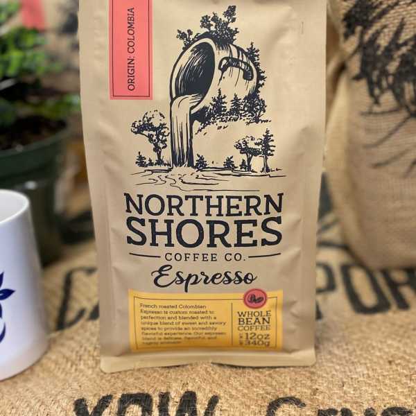 Bag of Northern Shores Coffee Co. espresso beans on a burlap surface