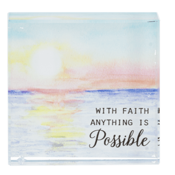 Decorative plaque with a sunrise scene and the words "With faith anything is possible"