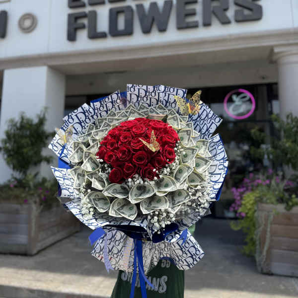 Bouquet of red roses wrapped with dollar bills and blue patterned paper