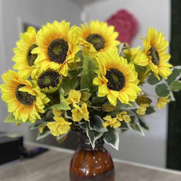 Sunflower bouquet in an amber glass vase