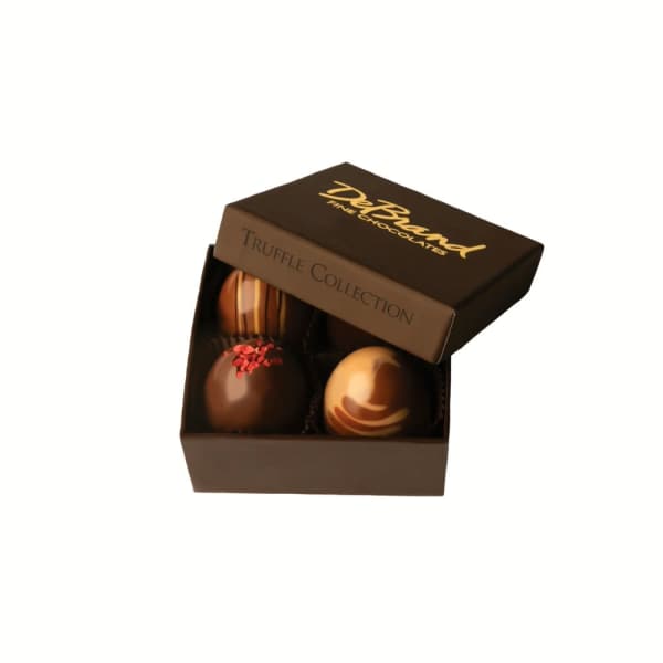 Box of assorted chocolate truffles with the lid open