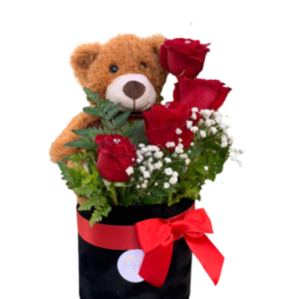 Teddy bear with red roses in a black box tied with a red ribbon