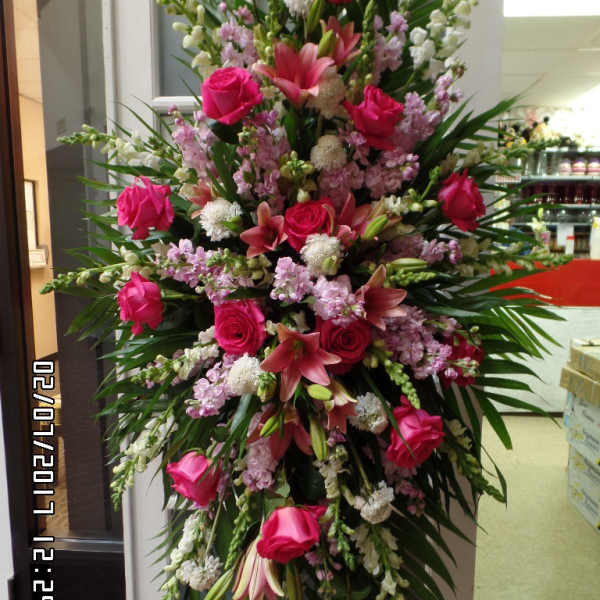 Tall standing floral spray with pink roses and lilies