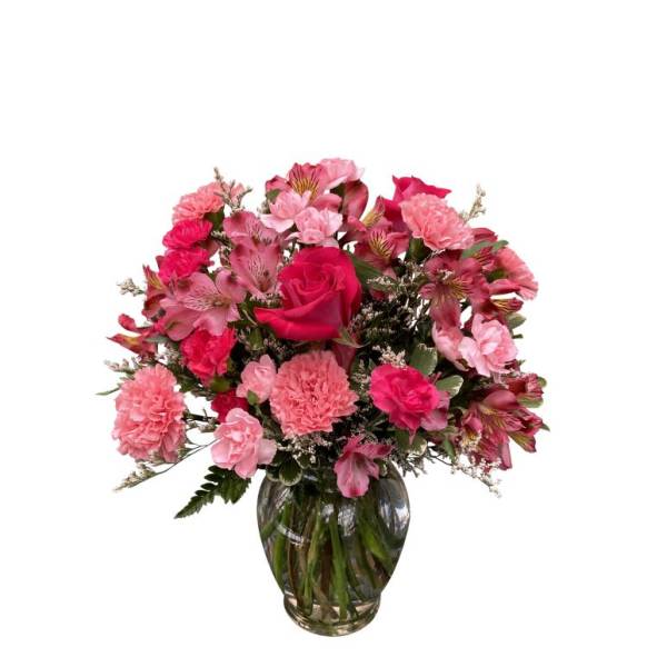 Pink mixed flower bouquet in a glass vase