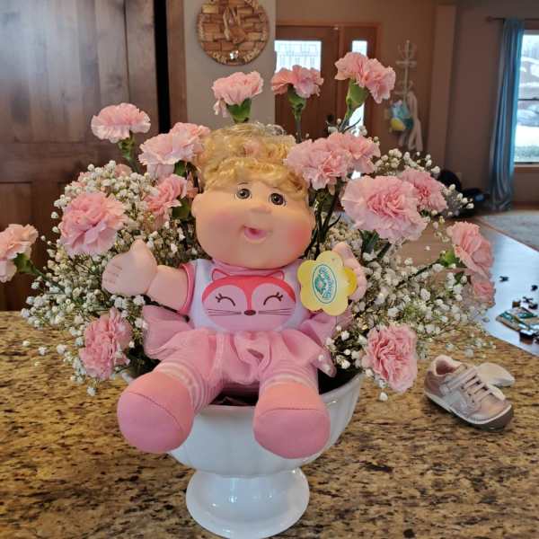 Pink Carnations, baby breath with a soft adorable baby girl or boy