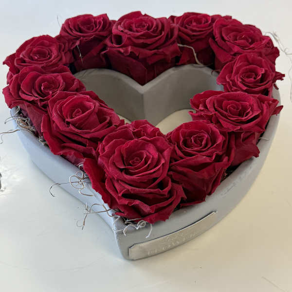 Heart-shaped box filled with red roses
