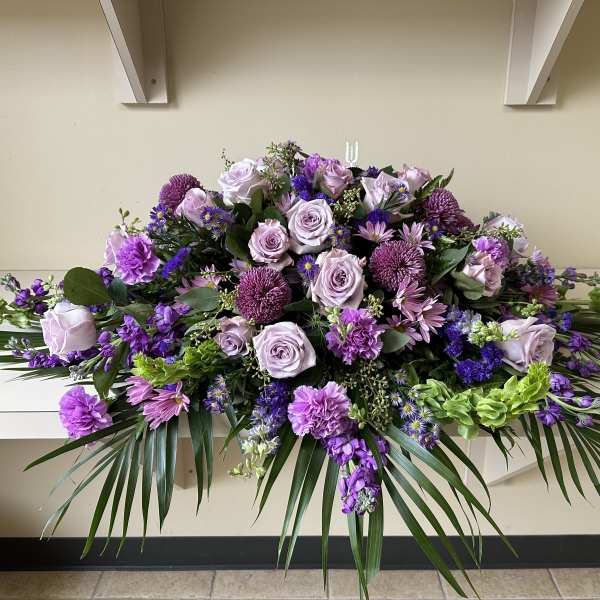 Large purple and lavender floral spray with roses and mums