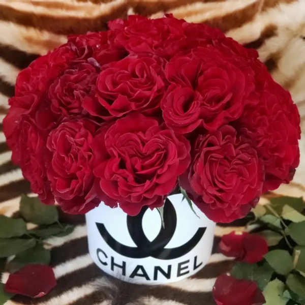 Red rose bouquet in a white Chanel-branded container