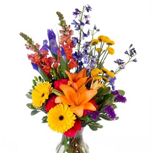 Colorful mixed bouquet in a clear glass vase