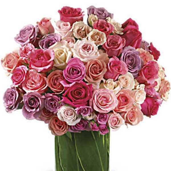 Bouquet of pink and lavender roses in a glass vase