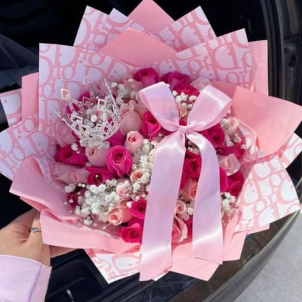Pink bouquet of roses with a satin ribbon and decorative wrap