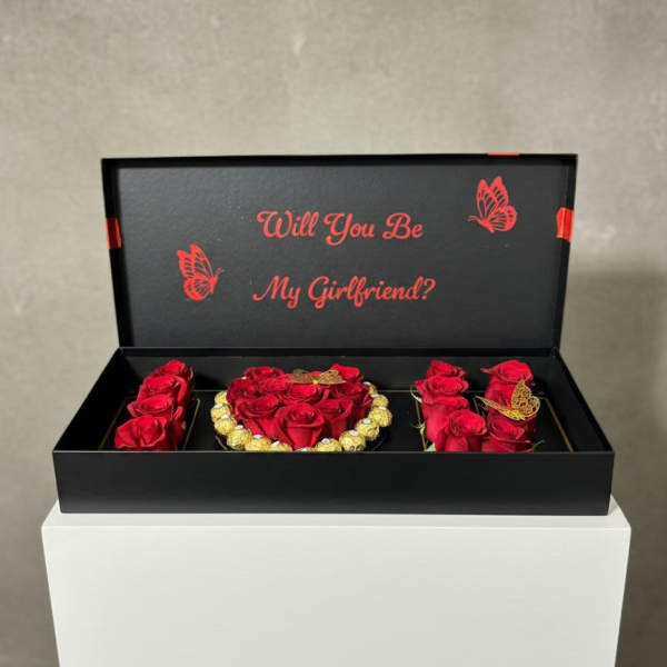 Black gift box with red roses and a "Will You Be My Girlfriend?" message
