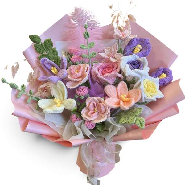 Bouquet of pastel crocheted flowers wrapped in pink paper
