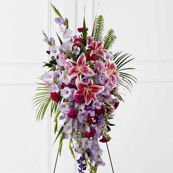 Tall standing spray of pink and lavender lilies and mixed flowers