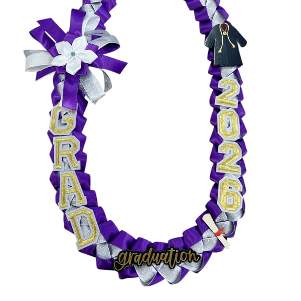 Purple and silver graduation lei with a flower accent and cap charm