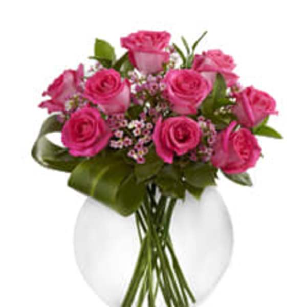 Pink roses arranged in a white vase