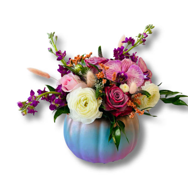 Mixed bouquet in an iridescent pumpkin vase with pink, white, and purple blooms