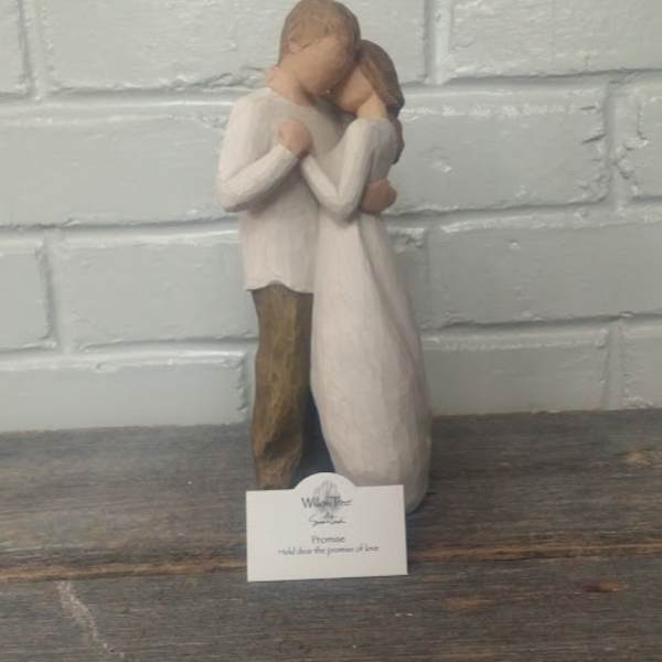 Wooden figurine of a couple embracing