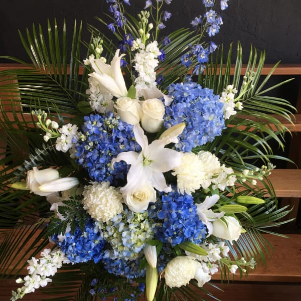 Blue and white floral standing spray with lilies and hydrangeas