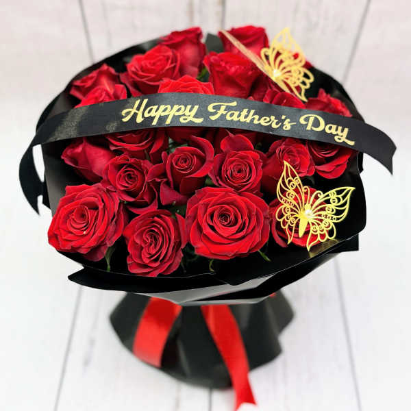 Bouquet of red roses with a Happy Father's Day ribbon