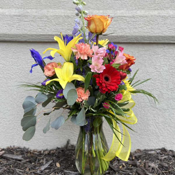 Colorful mixed bouquet in a clear glass vase