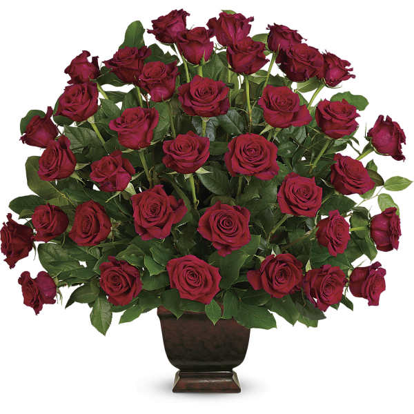 Large bouquet of red roses in a dark vase