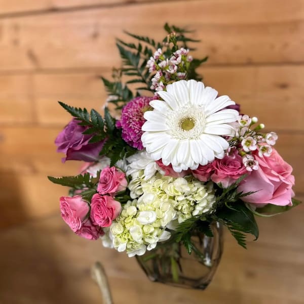 Pink and white mixed bouquet in a glass vase
