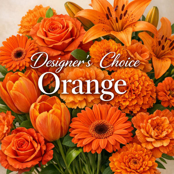 Orange floral arrangement with roses, lilies, tulips, and daisies