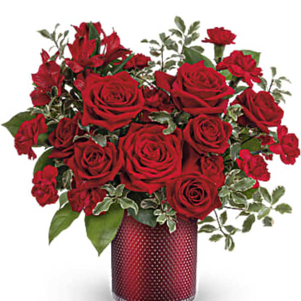 Red roses arranged in a red textured vase