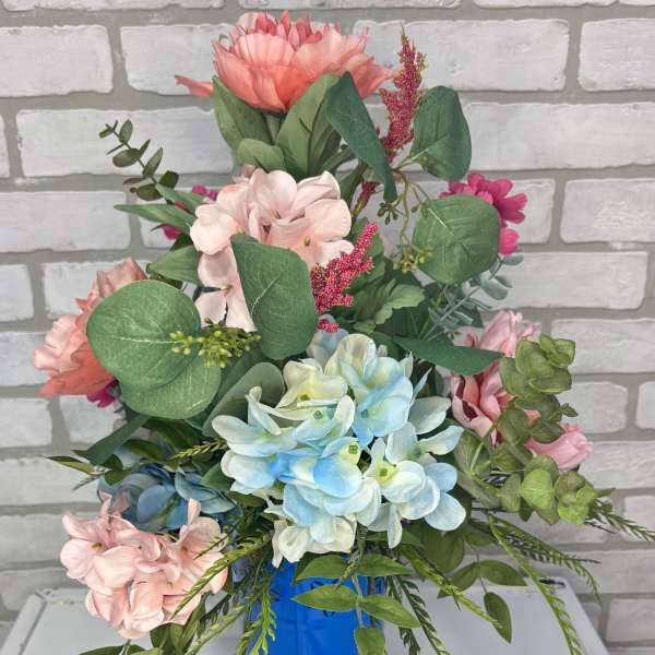 Bouquet of pastel flowers in a blue vase