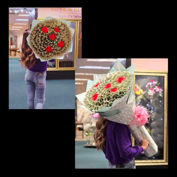 Large bouquet of red roses wrapped in patterned paper