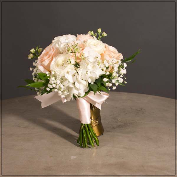 Blush and white bridal bouquet with ribbon wrap