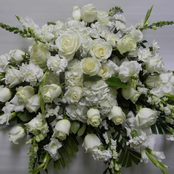 Large white floral spray with roses and carnations