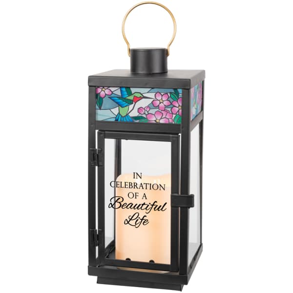 Black memorial lantern with a candle and stained-glass hummingbird design