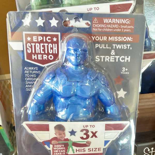 Blue stretch superhero toy in retail packaging