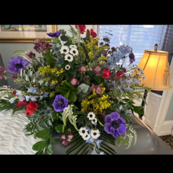 Large mixed bouquet with purple, red, white, and blue flowers