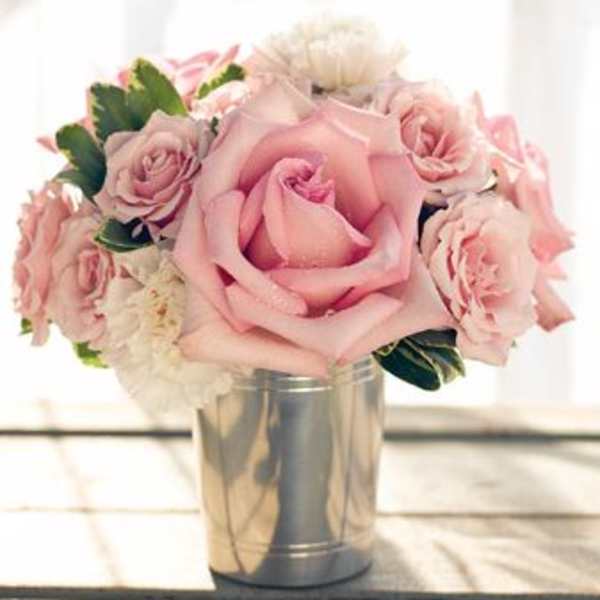 Pink rose bouquet in a silver tin vase