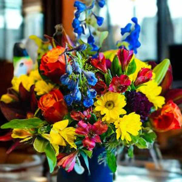 Colorful mixed bouquet in a blue vase