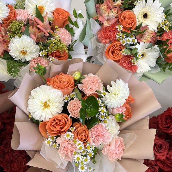 Florist Choice- Orange and Whites Wrapped Bqt
