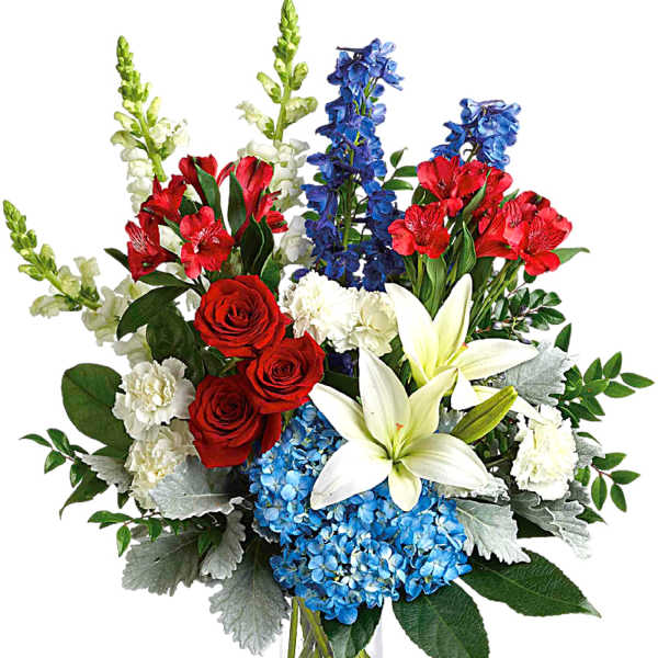 Bouquet of red roses, white lilies, blue hydrangeas, and red alstroemeria in a glass vase
