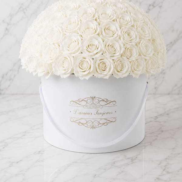 White rose dome arrangement in a round white box