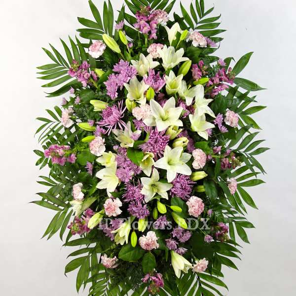 Standing floral spray with white lilies and pink flowers