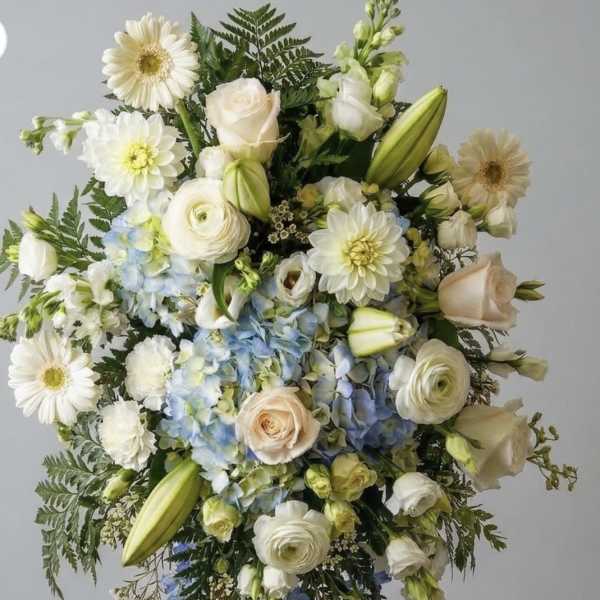 Soft touch of blue Funeral Spray
