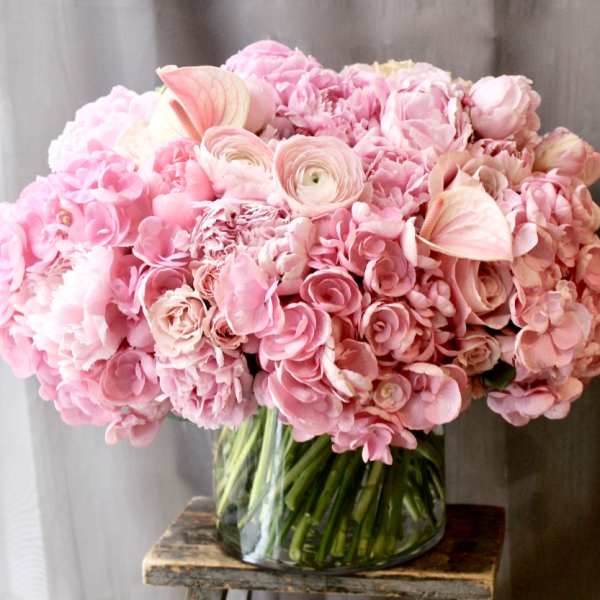 Pink floral arrangement in a clear glass vase