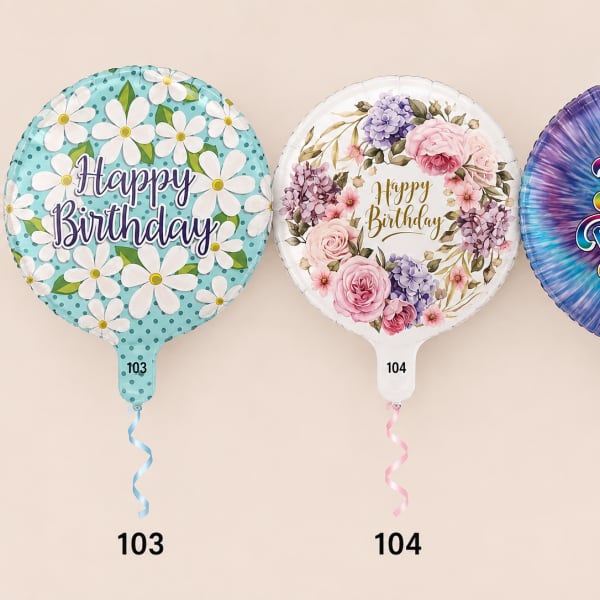 Three birthday balloons with floral prints and curled ribbons