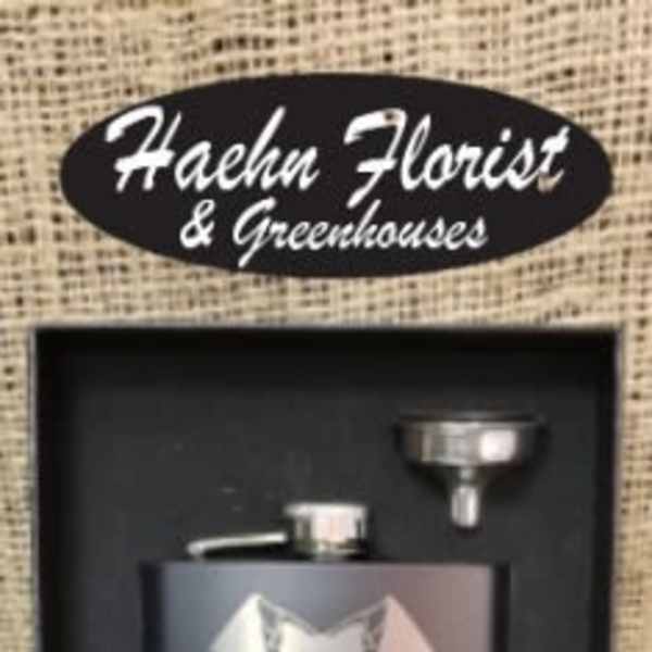 Gift set with a black flask and funnel in a display box