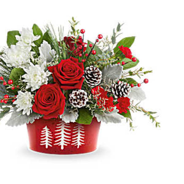 Red roses and white flowers in a red holiday container