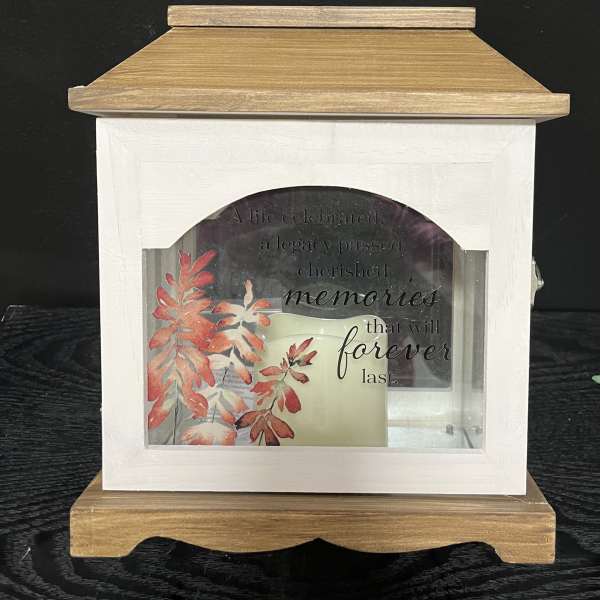 Wooden memorial lantern with a candle and autumn leaf design