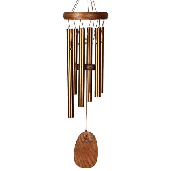 Wooden wind chime with gold metal tubes and a hanging wooden clapper
