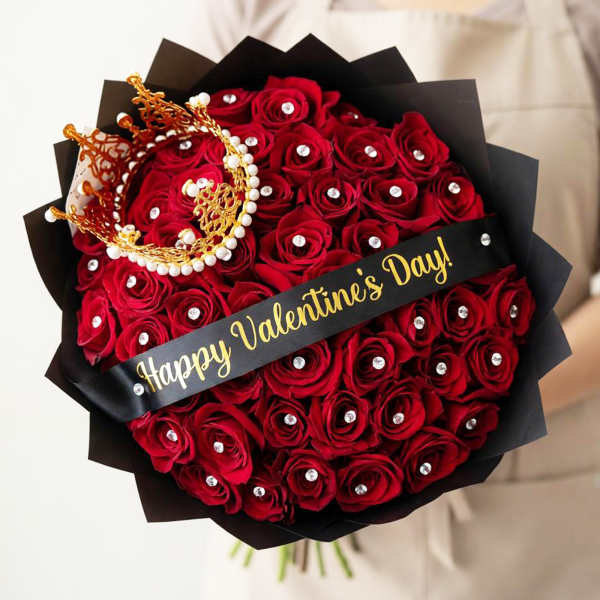 Bouquet of red roses with black wrapping and a Happy Valentine's Day ribbon